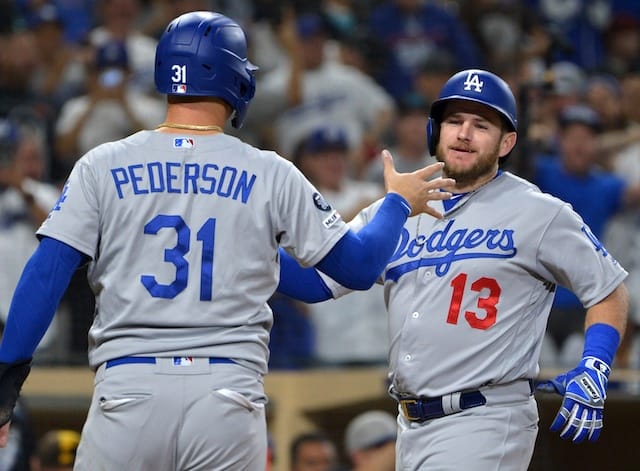 Los Angeles Dodgers teammates Max Muncy and Joc Pederson celebrate after a grand slam
