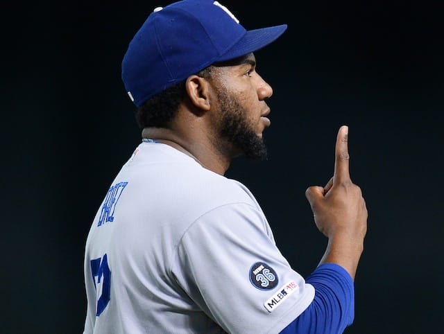 Los Angeles Dodgers relief pitcher Pedro Baez celebrates after his first career save