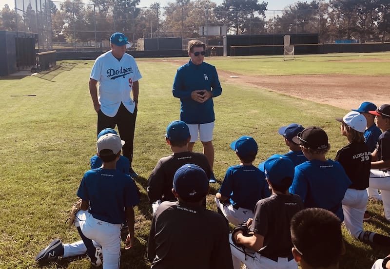 Los Angeles Dodgers legends Steve Garvey and Mickey Hatcher speak with a Lifeletics youth travel team