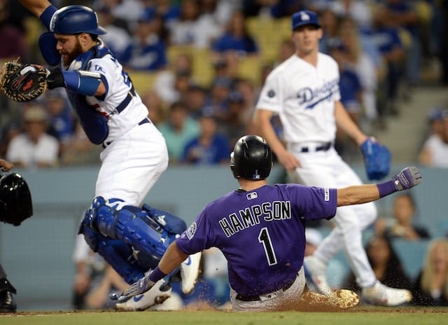 Los Angeles Dodgers catcher Russell Martin avoids a slide into home plate