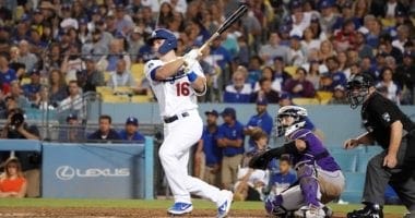 Los Angeles Dodgers catcher Will Smith hits an RBI infield single