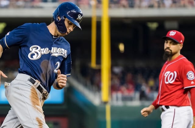 Washington Nationals third baseman Anthony Rendon watches Milwaukee Brewers outfielder Christian Yelich round the bases after hitting a home run