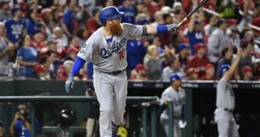 Los Angeles Dodgers third baseman Justin Turner watches his home run during Game 3 of the 2019 NLDS