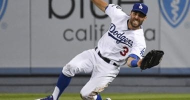 Los Angeles Dodgers utility player Chris Taylor makes a sliding catch during Game 1 of the 2019 NLDS
