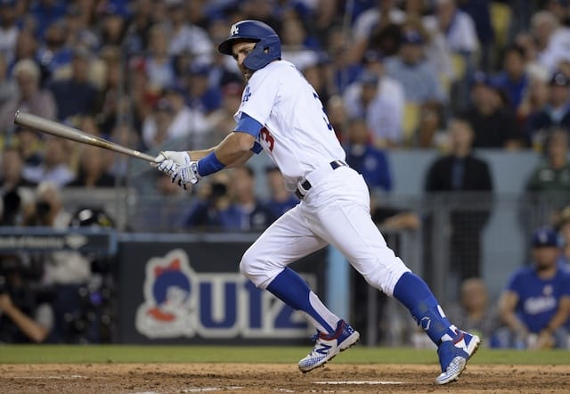 Los Angeles Dodgers utility player Chris Taylor hits an infield single during Game 1 of the 2019 NLDS