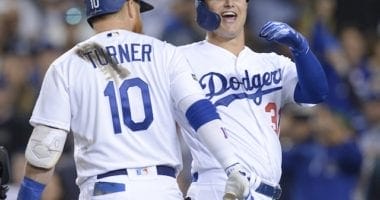 Los Angeles Dodgers teammates Joc Pederson and Justin Turner celebrate after a home run in Game 1 of the 2019 NLDS