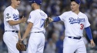 Los Angeles Dodgers teammates Joe Kelly, Joc Pederson and Corey Seager celebrate after winning Game 1 of the 2019 NLDS
