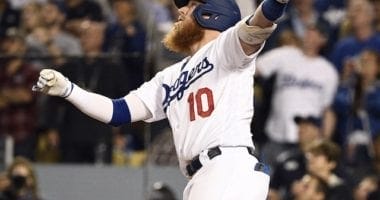 Los Angeles Dodgers third baseman Justin Turner hits a sacrifice fly during Game 2 of the 2019 NLDS