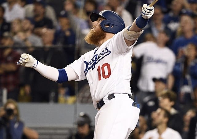 Los Angeles Dodgers third baseman Justin Turner hits a sacrifice fly during Game 2 of the 2019 NLDS