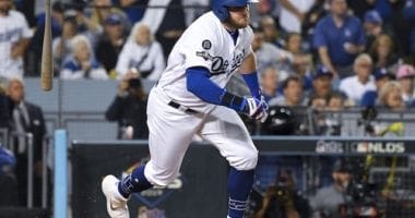 Los Angeles Dodgers infielder Max Muncy hits a two-run single against the Washington Nationals in Game 1 of the 2019 NLDS