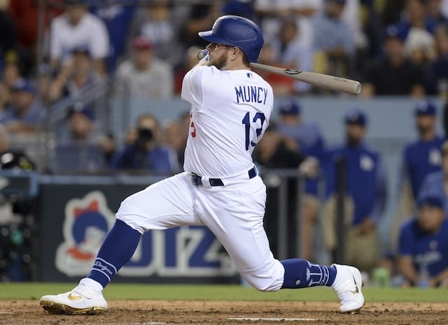 Los Angeles Dodgers infielder Max Muncy hits a single during Game 1 of the 2019 NLDS