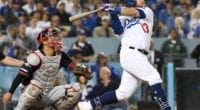 Los Angeles Dodgers infielder Max Muncy hits a home run during Game 2 of the 2019 NLDS