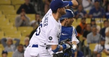 Los Angeles Dodgers All-Star Cody Bellinger throws out San Francisco Giants catcher Stephen Vogt