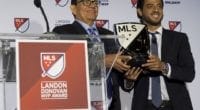 Former Los Angeles Dodgers pitcher Fernando Valenzuela presents the MLS MVP trophy to Los Angeles FC forward Carlos Vela