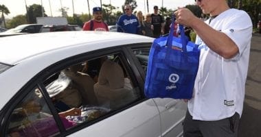 Los Angeles Dodgers outfielder Joc Pederson at the annual Thanksgiving giveaway