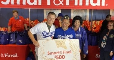 Los Angeles Dodgers outfielder presents a Smart & Final gift card during a Thanksgiving giveaway
