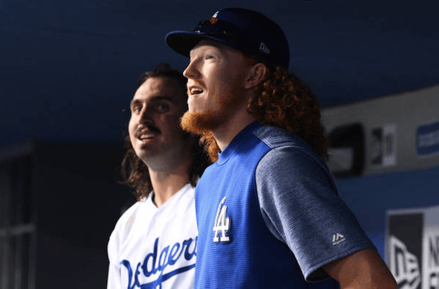Los Angeles Dodgers pitcher Tony Gonsolin and Dustin May in the dugout at Dodger Stadium