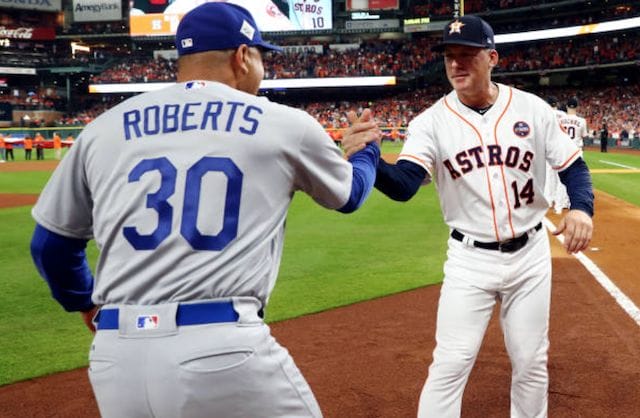 Houston Astros manager AJ Hinch greets Los Angeles Dodgers manager Dave Roberts during the 2017 World Series