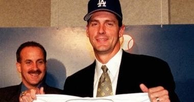 Kevin Brown after signing with the Los Angeles Dodgers to become the first $100 million player