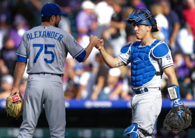 Los Angeles Dodgers teammates Scott Alexander and Austin Barnes celebrate after a win against the Colorado Rockies