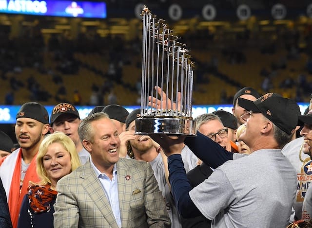 Former Houston Astros manager AJ Hinch hoists the 2017 World Series trophy
