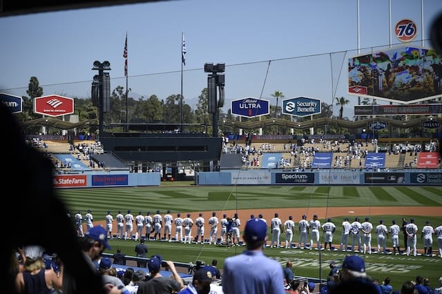 Dodgers lined up, national anthem, World Series banner