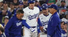 Freddie Freeman, Dodgers trainer Yosuke "Possum" Nakajima, Dave Roberts, Clayton McCullough